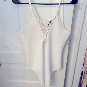 White thing bodysuit with sexy lace up front